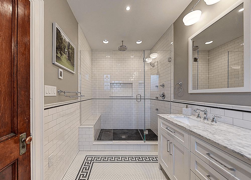 Bathroom Remodel Near Me: How to Choose the Right Pro 2 Homeowner comparing tile samples during a bathroom remodel planning meeting